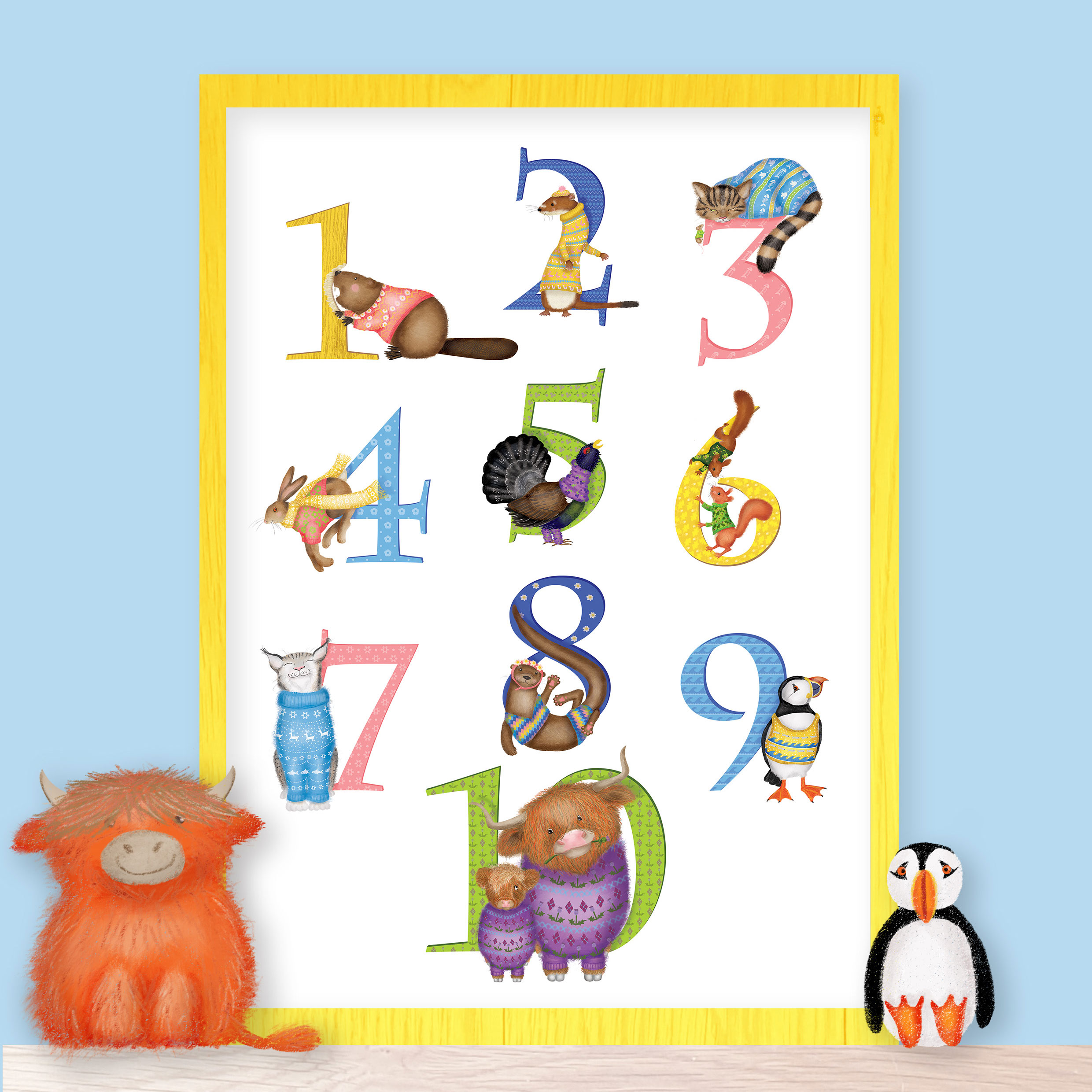10 Scottish animals nursery print on a shelf with a toy Highland coo and puffin