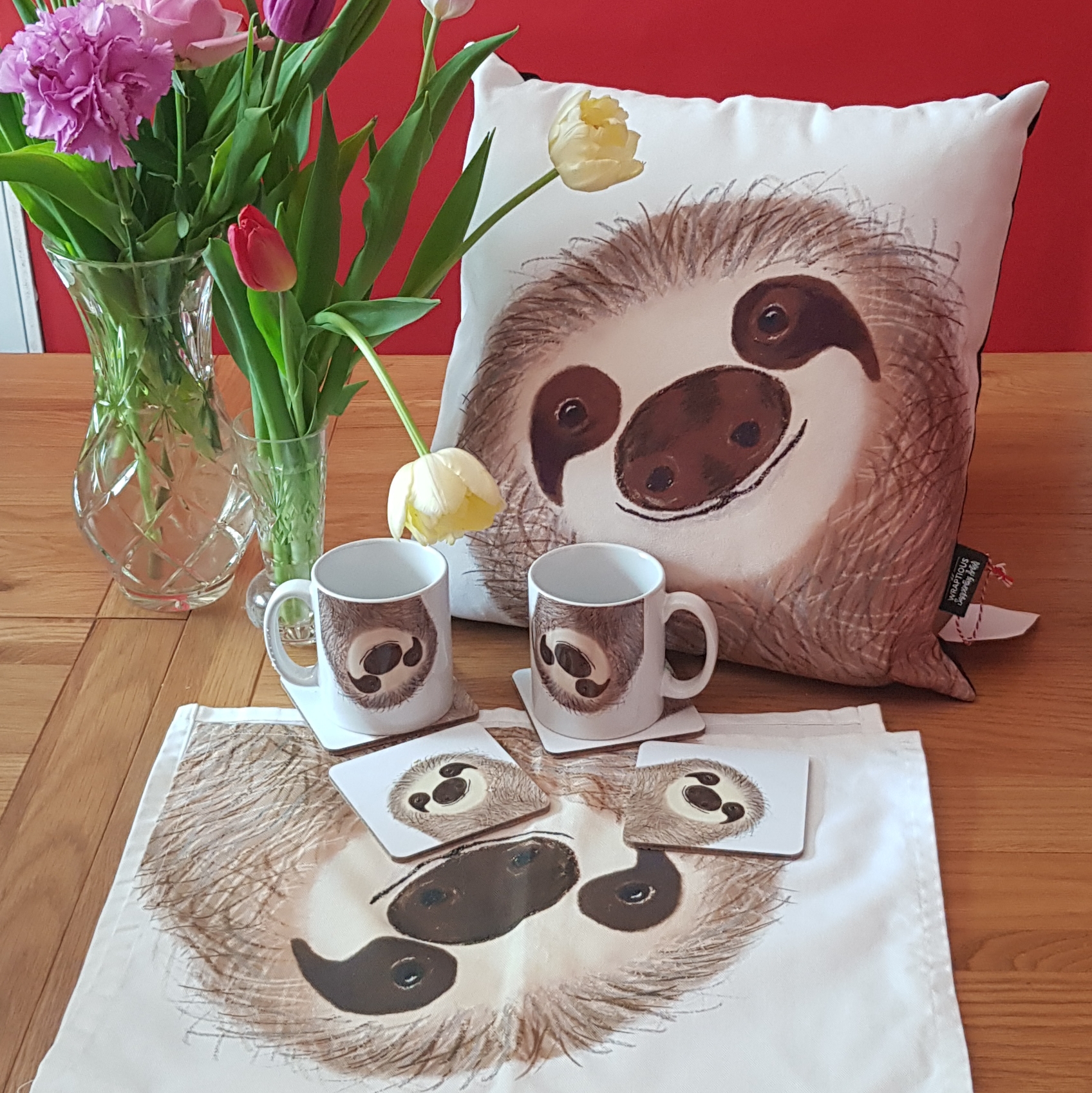 Cusion, mug and coasters and tea towel featuring Stanley sloth