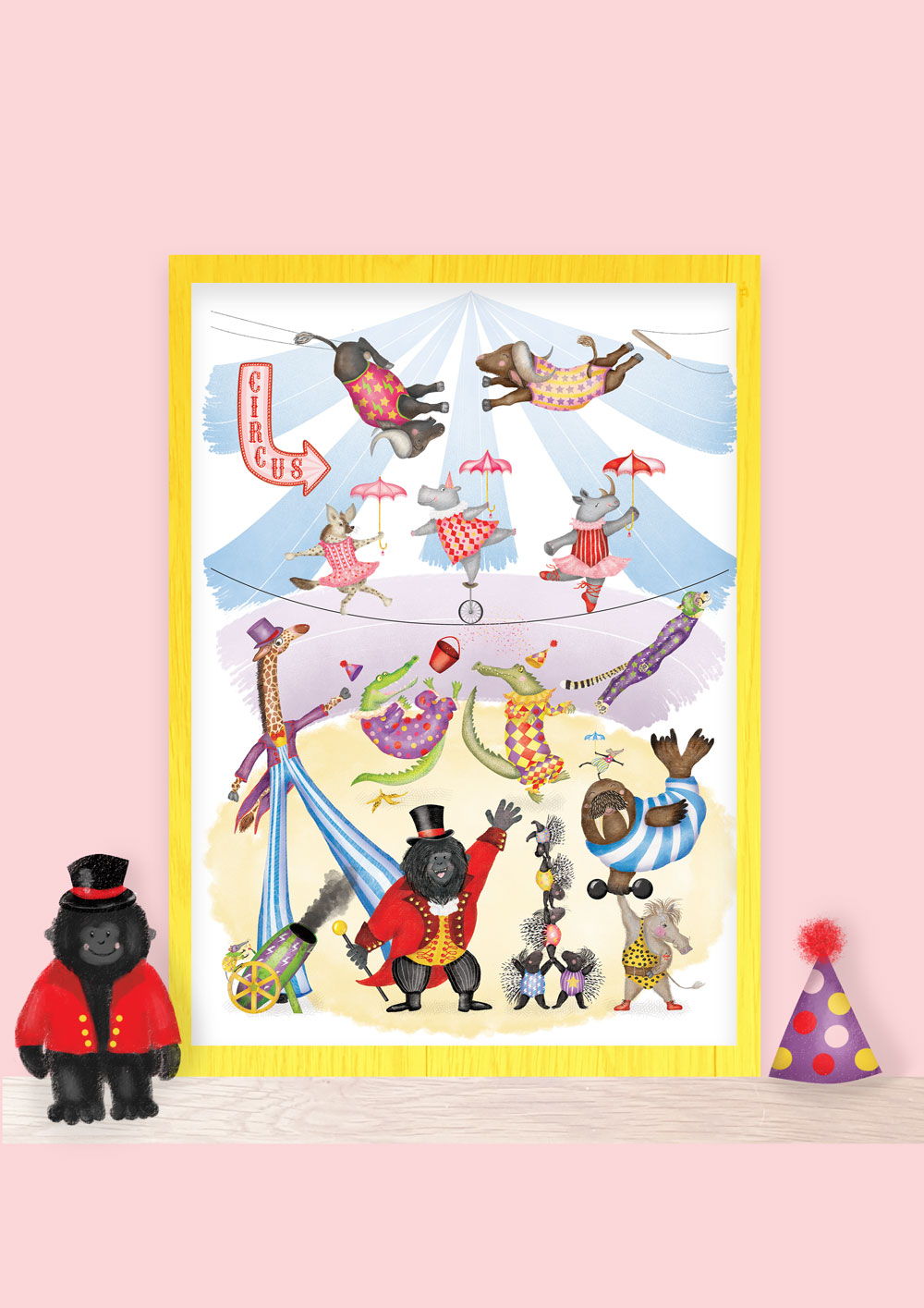 Silly Circus print on a shelf with a toy gorilla ringmaster and clown's hat.