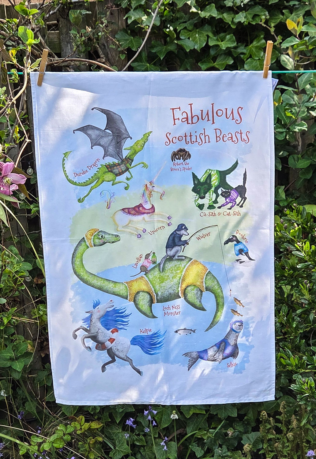 Tea towel with images of fabulous Scottish beasts including the Loch Ness Monster, Kelpie and Selkie.