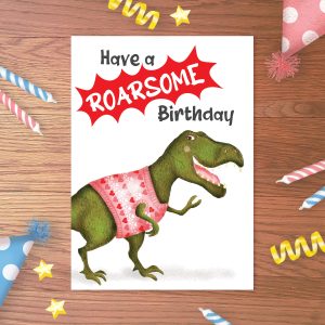 Birthday card with a T.rex wearing a pink jumper, with 'Have a ROARSOME birthday' above.
