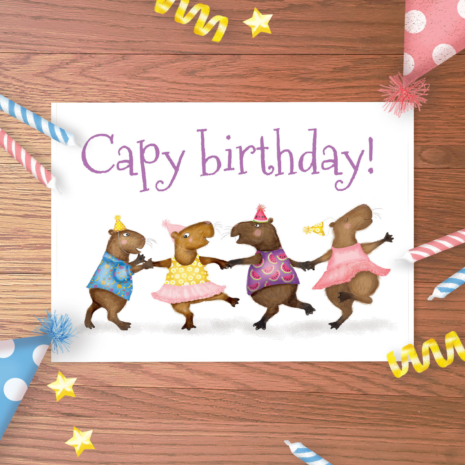 Birthday card with four dancing capybara in party outfits, with Capy birthday! written above.