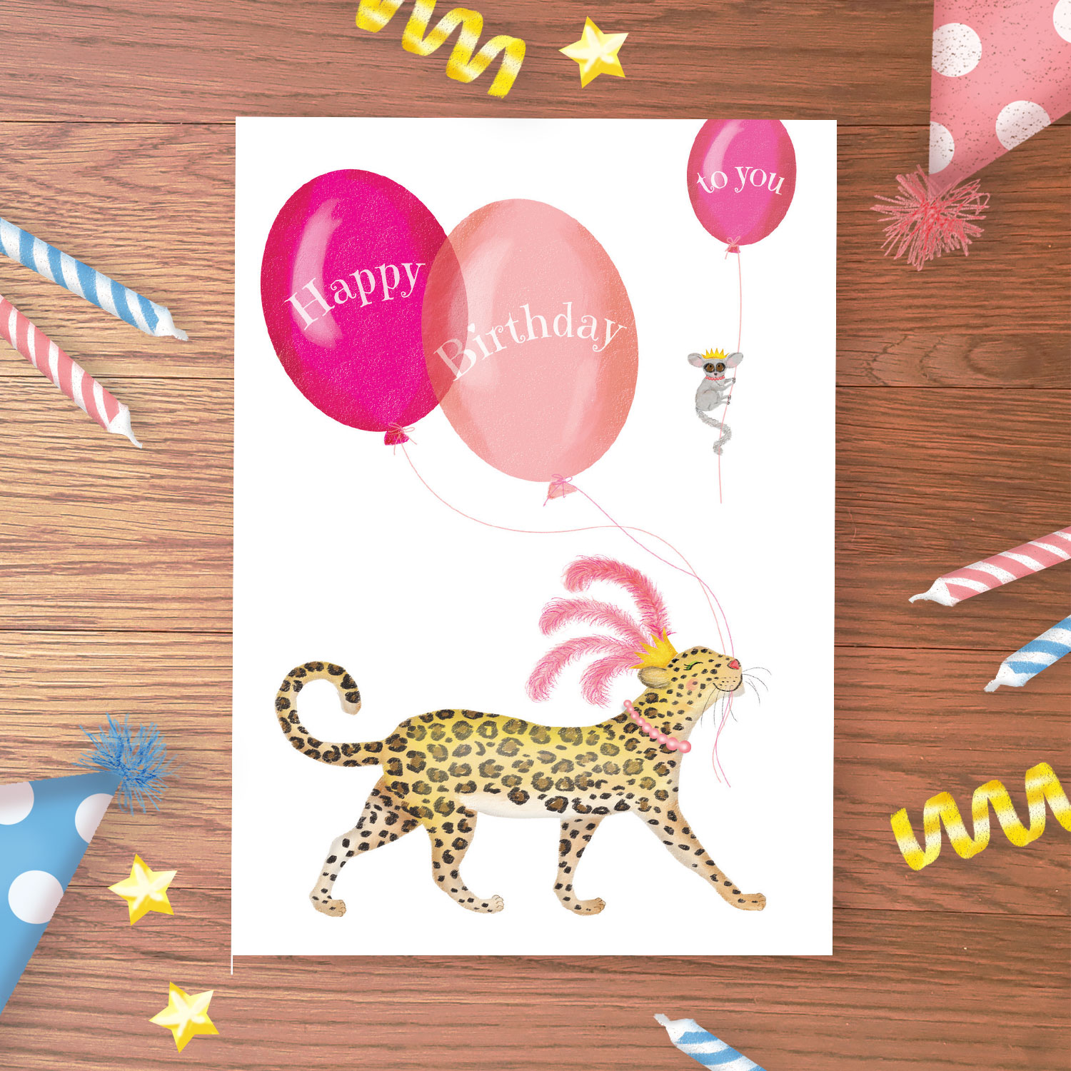Birthday card with a leopard with a feather headdress hold balloons saying 'Happy Birthday', while a mouse holding a balloon saying 'to you' floats away,