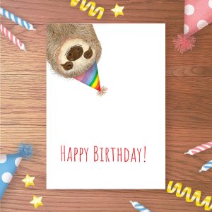 Birthday card with a sloth wearing a rainbow party hat.
