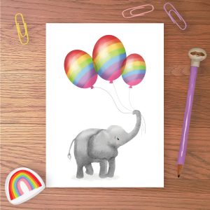 Greetings card with a baby elephant holding three rainbow balloons in his trunk.