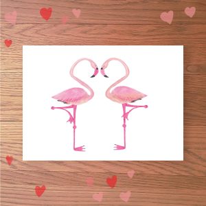 Greetings card with two flamingos making a heart shape with their necks.