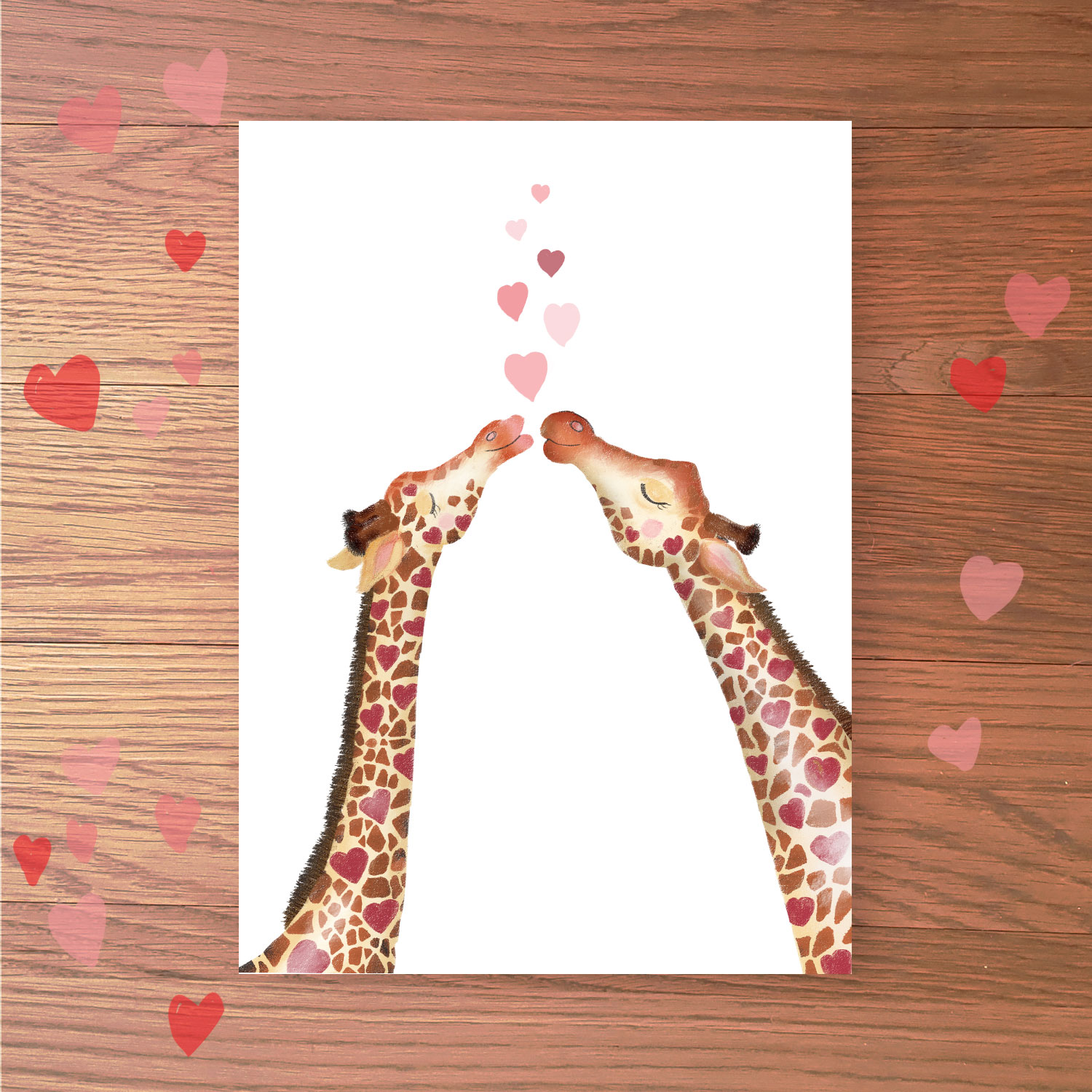 Greetings card with two giraffes kissing.