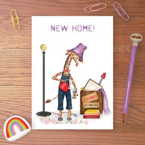 Greetings card with a giraffe with a lampshade on his head, making tea in a vase, with a packing case behind him and NEW HOME written above,