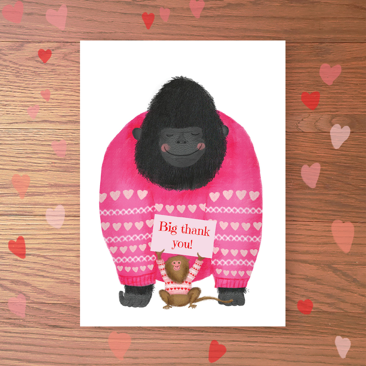 Greetings card with a gorilla and pygmy marmoset wearing jumpers with hearts on. The marmoset is holding up a sign that reads 'Big thank you!'