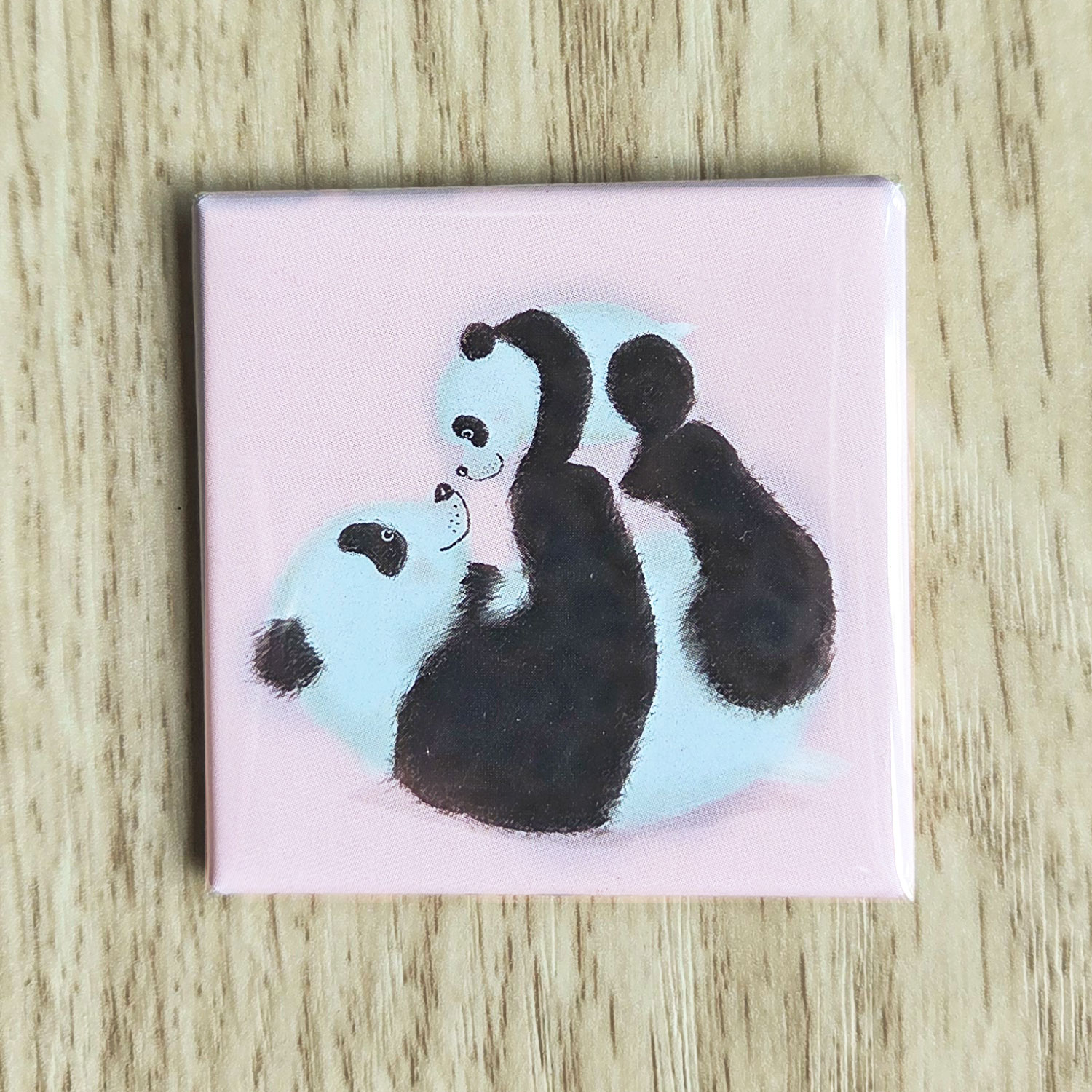Square magnet with a cute mother panda and cub on a pink background.