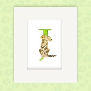 Mounted print hanging on the wall, of a green capital letter J with a cute mother jaguar and cub.