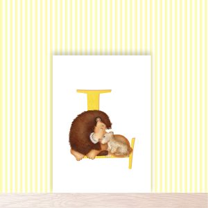 Yellow capital letter L with a cute father lion and cub with their noses pressed together.