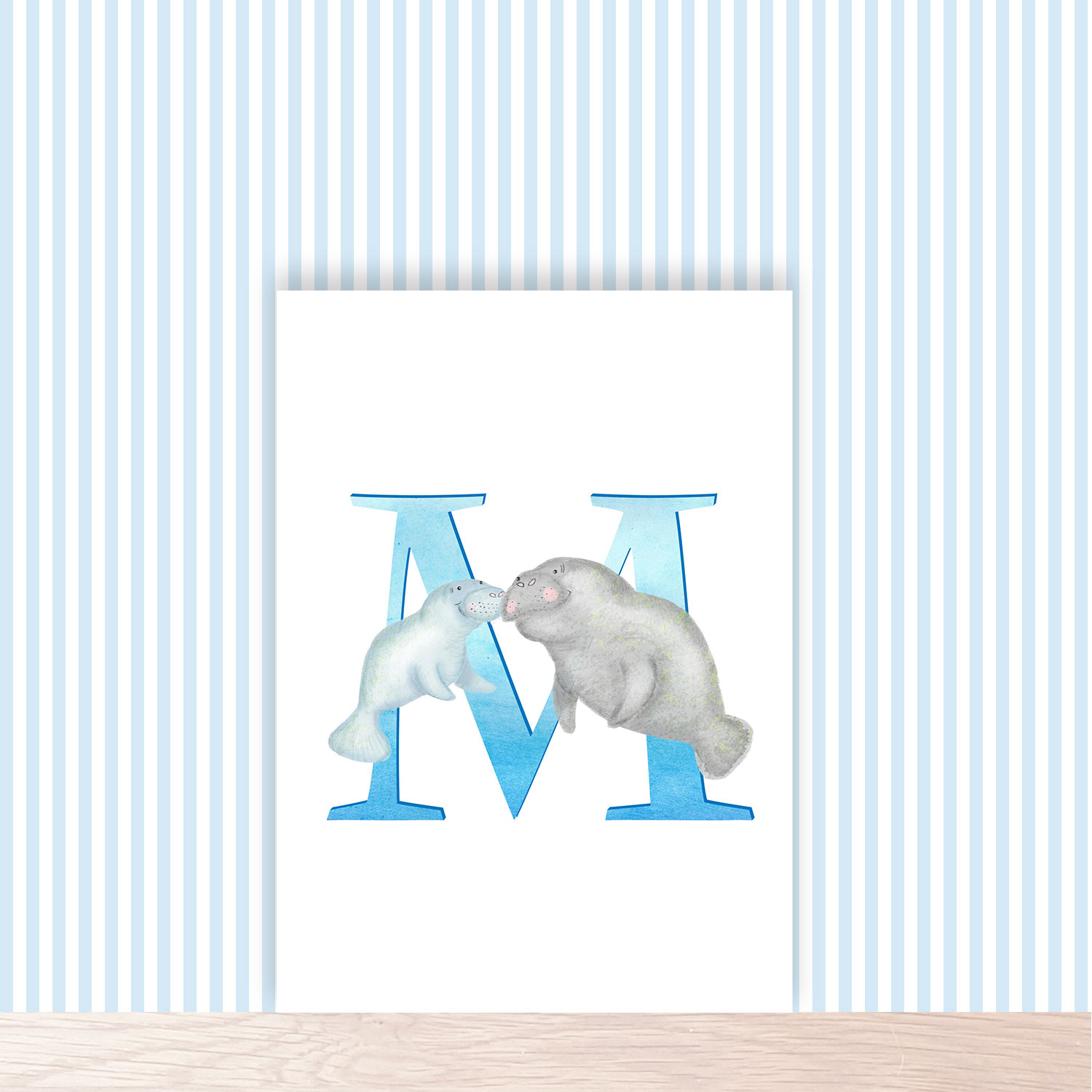 Blue capital letter M with a cute mother and baby manatee swimming together.