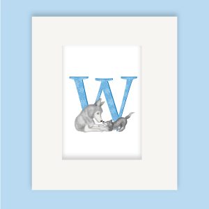 Mounted print hanging on the wall, of a blue capital letter W with a cute mother wolf and cub playing together.