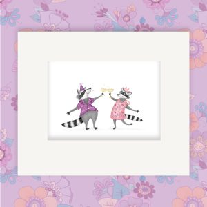 Mounted print hanging on a wall, of two raccoons wearing party outfits, clinking glasses of champagne.