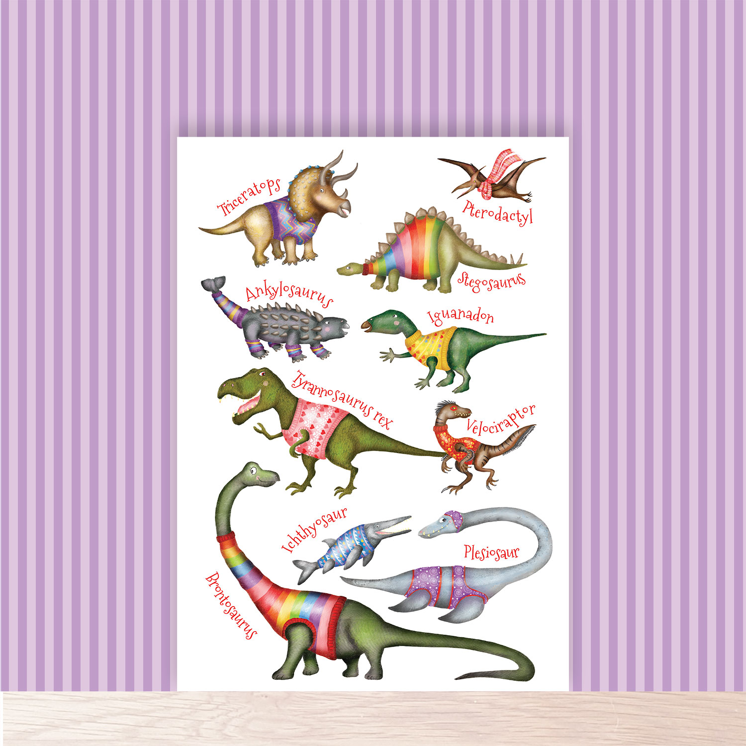 Fun colourful A4 print of dinosaurs wearing jumpers.