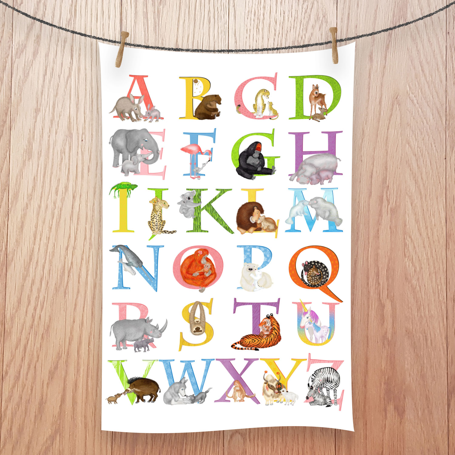 Tea towel featuring a colourful alphabet with animals illustrating each letter.