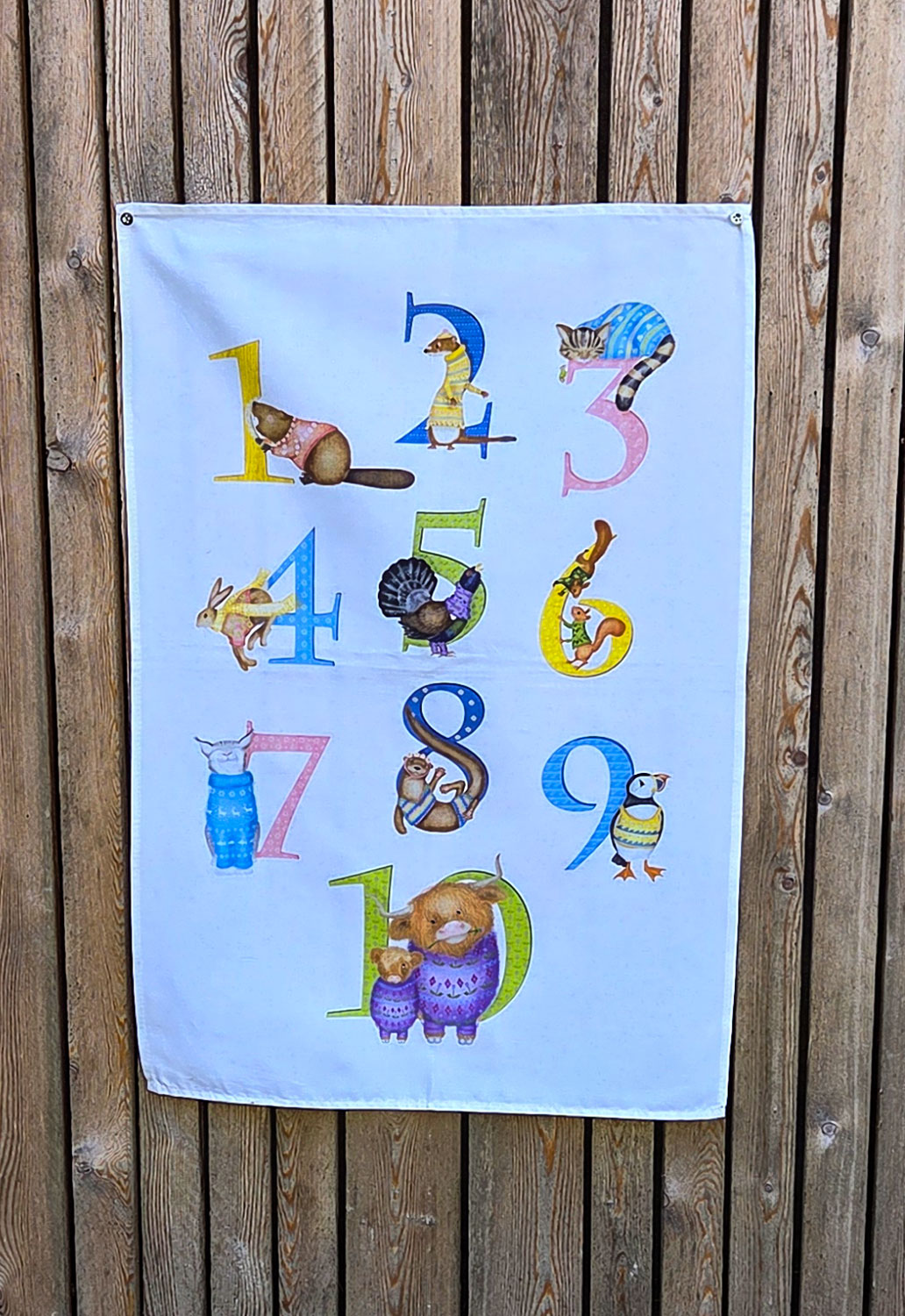 Tea towel with the numbers 1-10 illustrated with Scottish animals.