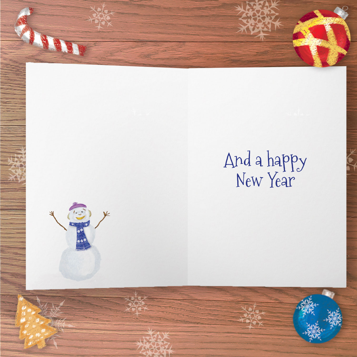 Inside of a greetings card with the text And a happy New Year and a drawing of a snowman.