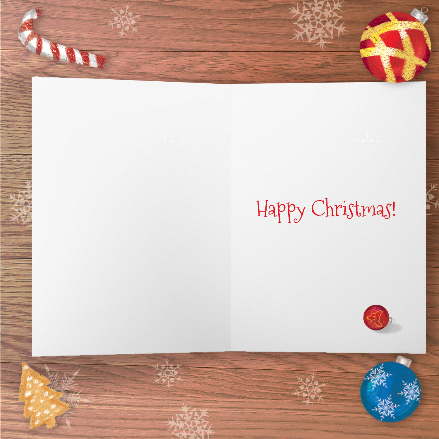 Inside of a greetings card with the text Happy Christmas and a drawing of a Christmas bauble.