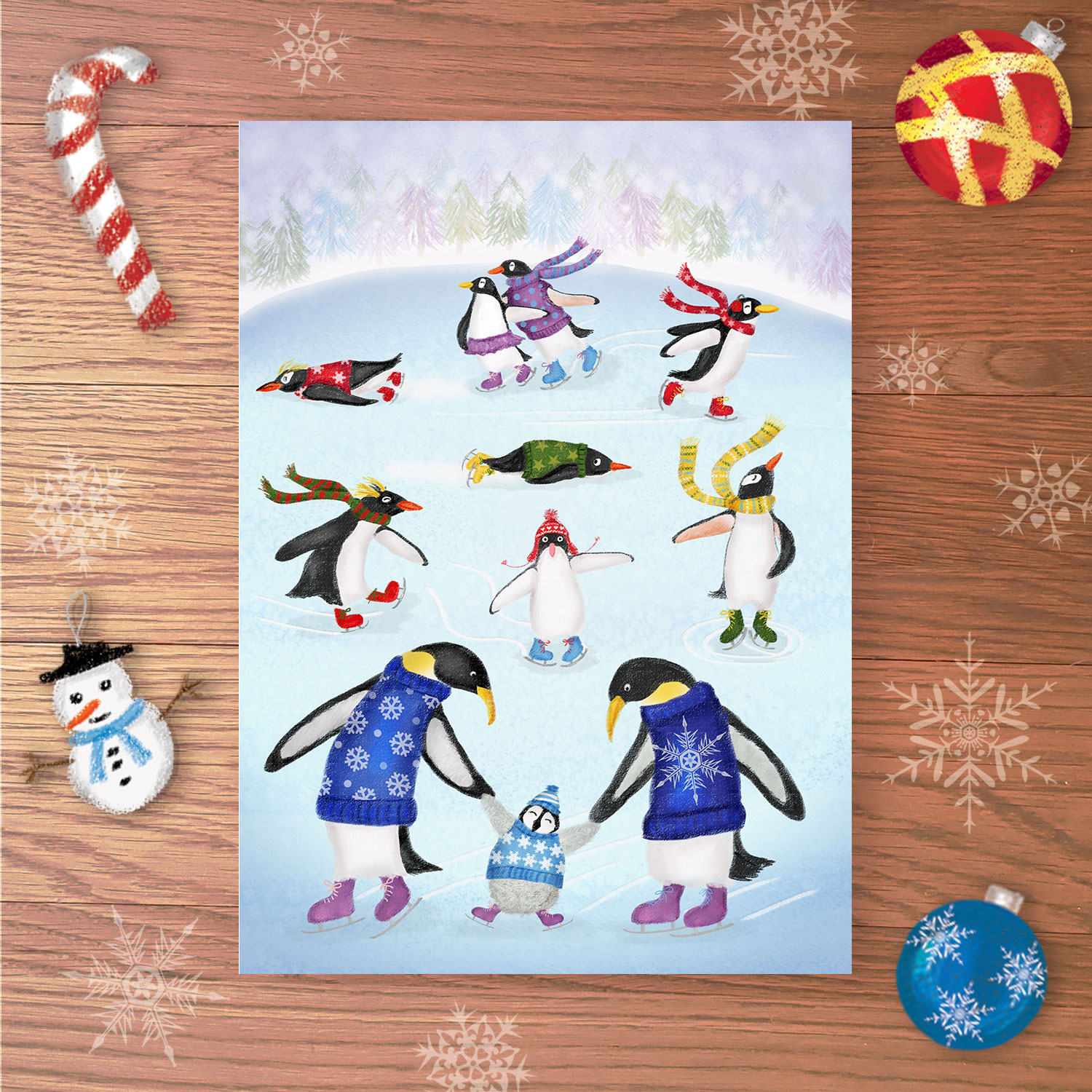 Christmas card with penguins wearing ice skates and Christmas jumpers and knitwear, skating on a frozen pond.