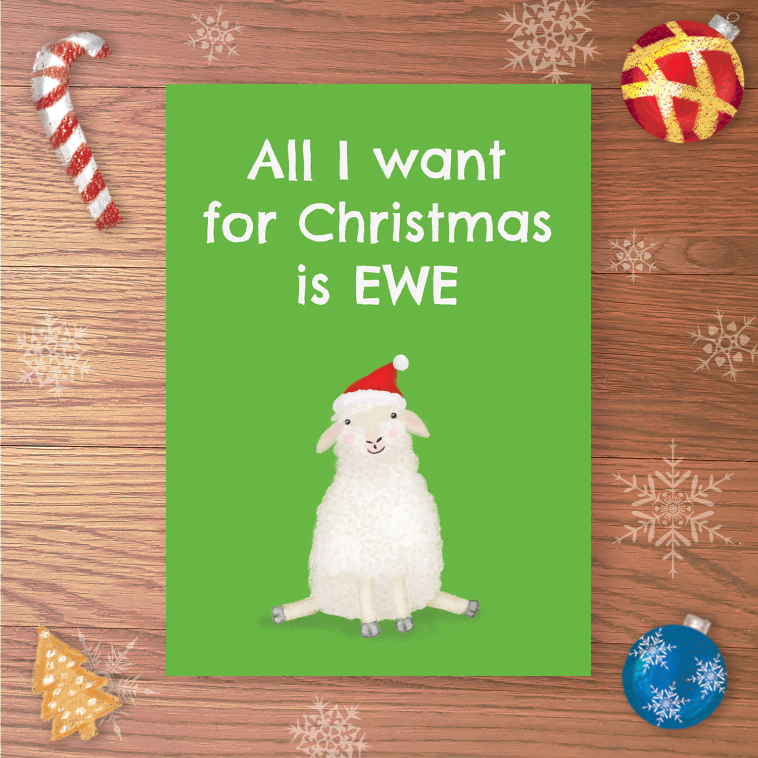 Christmas card with a sheep wearing a Santa hat and All I want for Christmas is EWE written above.