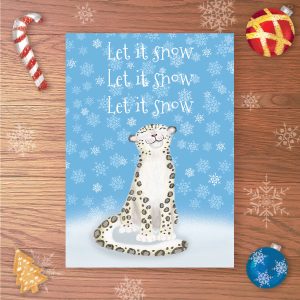 Christmas card with a snow leopard in a snowy scene and Let it snow, Let it snow, Let it snow written above.