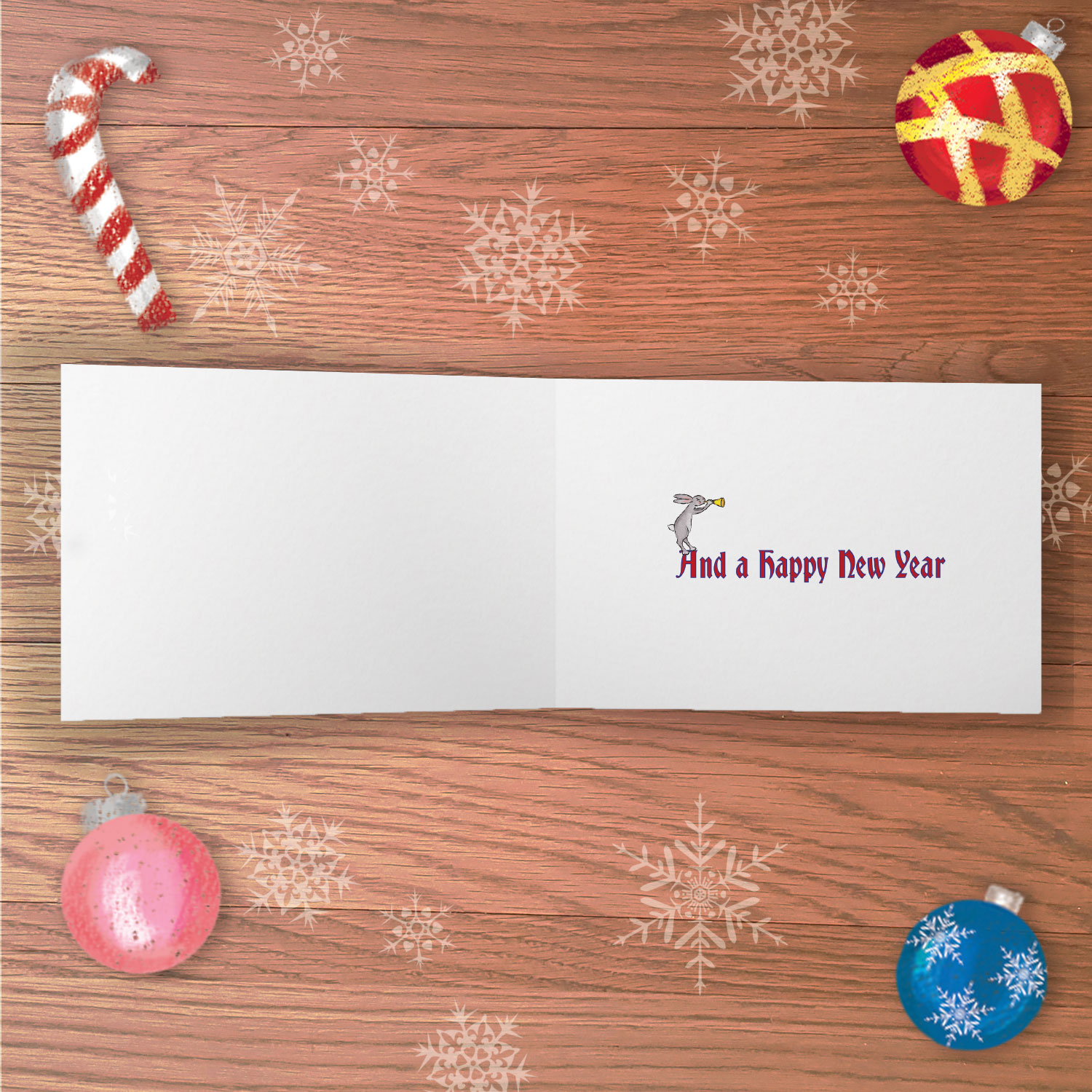 Open greetings card with And a Happy New Year written inside and a drawing of a rabbit blowing a horn.