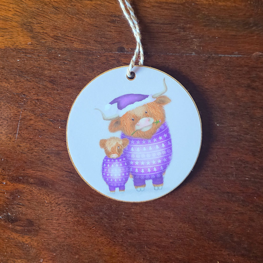 Hanging decoration featuring a mother Highland cow wearing a purple jumper and matching Santa hat, and her cute calf.