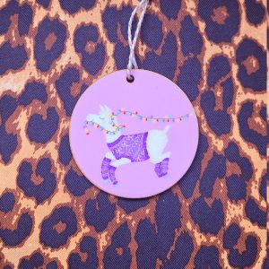 Pink hanging decoration with a llama wearing a pink festive jumper, carrying a string of fairy lights in her mouth.